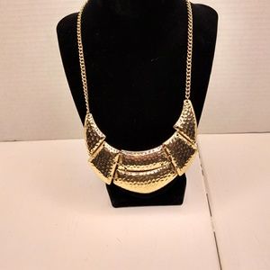 Tribal gold tone necklace